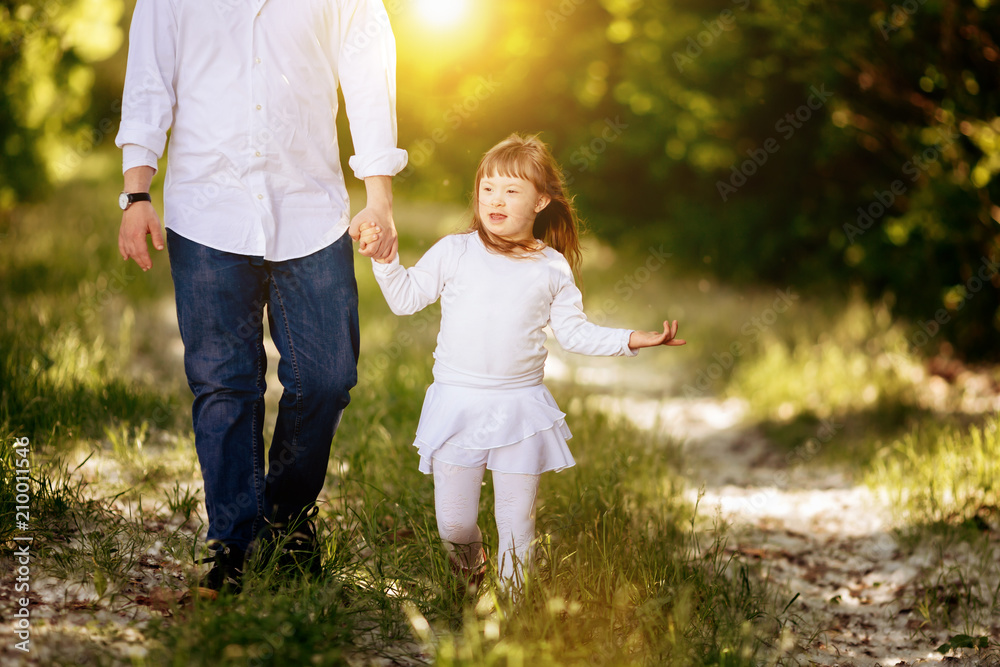 Fototapeta premium People with down sydrome walking in forest