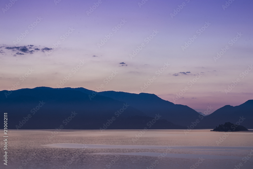 Mountains landscape at sunrise - cloudy sky in pastel colors for your design, serenity and rose quartz.