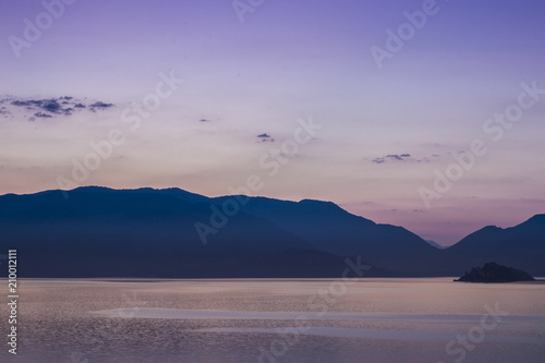 Mountains landscape at sunrise - cloudy sky in pastel colors for your design, serenity and rose quartz.