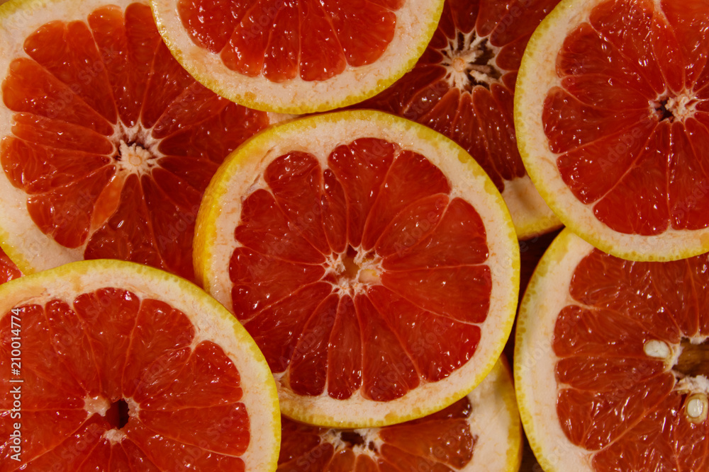 Fresh slices of grapefruits as background Fresh slices of grapefruits as background