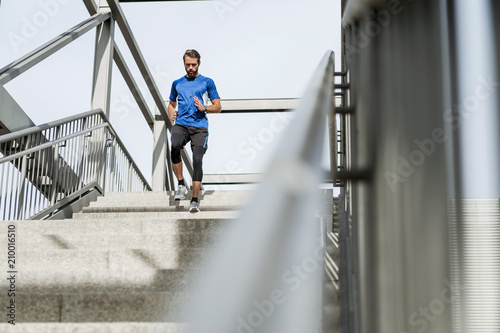 Man running down stairs