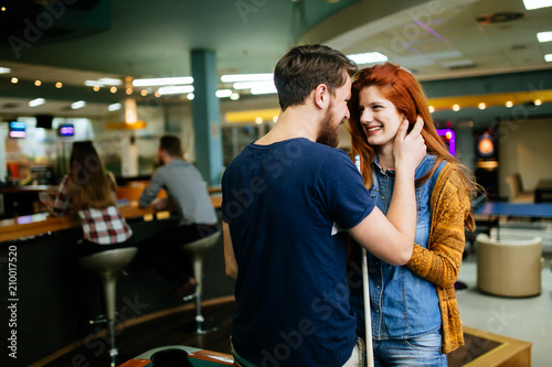Couple hugging in snooker bar © NDABCREATIVITY