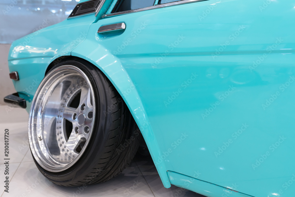 Aggressive Wheel Offset in a retcar.
Hella Flush is Wheel offset, Small stretched tires, on a slammed vehicle = flush, or hella flush as people like to say.
Rims with a lot of offset.