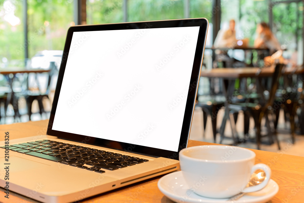 Business object laptop and cp of coffee on a wooden table Business object laptop and cp of coffee on a wooden table