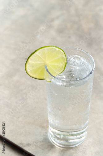 Glass of fresh drinking water with slice of lime