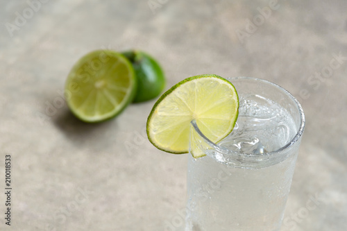 Glass of fresh drinking water with slice of lime
