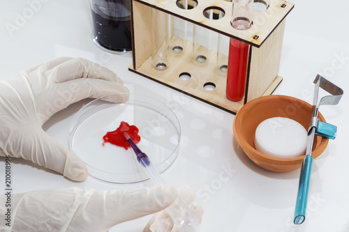 Lab tube, eppendorfs with red liquid. White background. Studio shot. photo