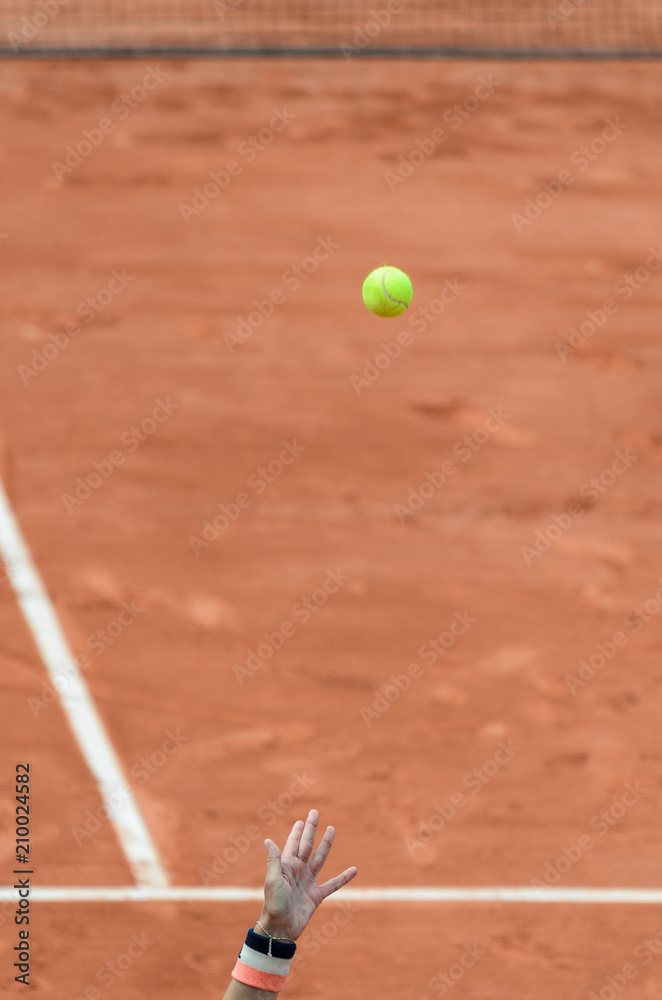 Hand toss the ball in tennis game