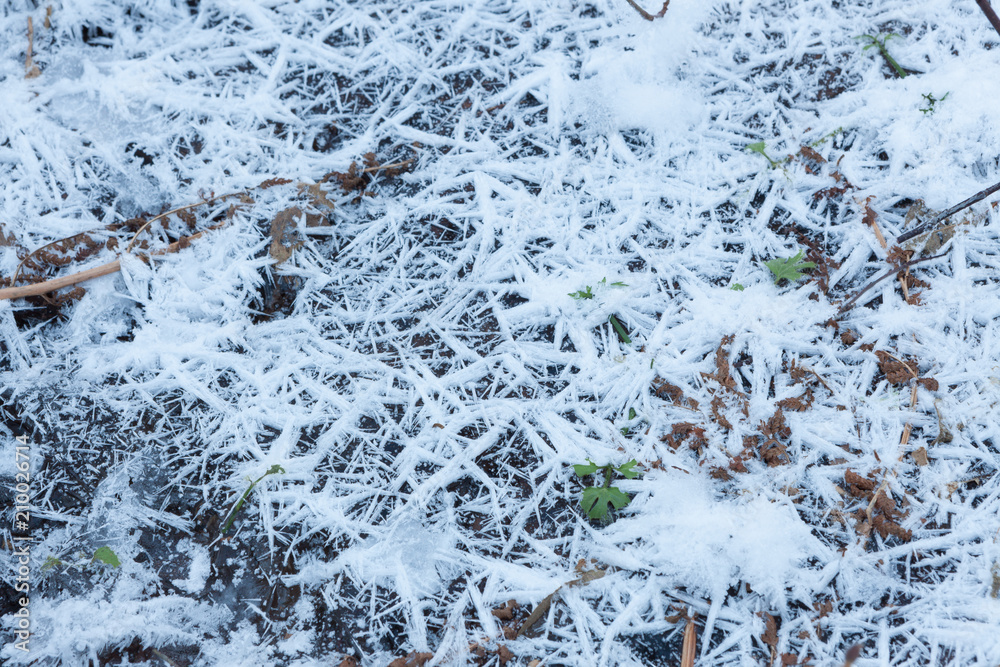 Snow crystals on ground close-up background Snow crystals on ground close-up background