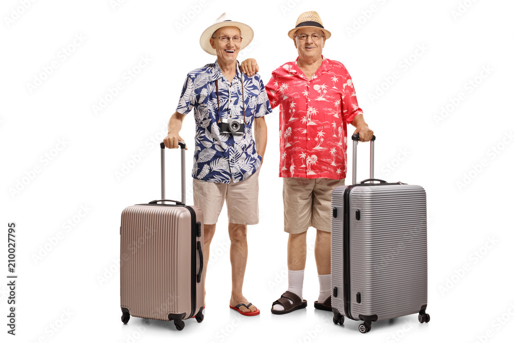 Two elderly tourists with suitcases