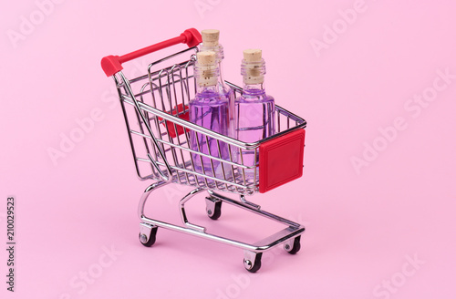 Bottles in mini shopping cart
