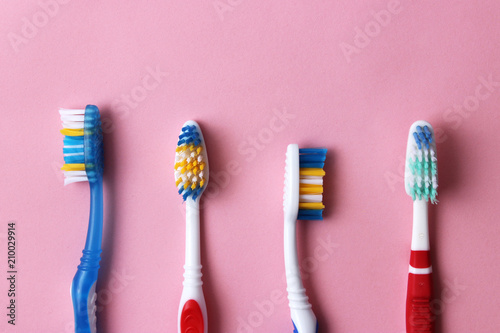 toothbrushes on a colored background top view. oral health, brush your teeth, healthy teeth