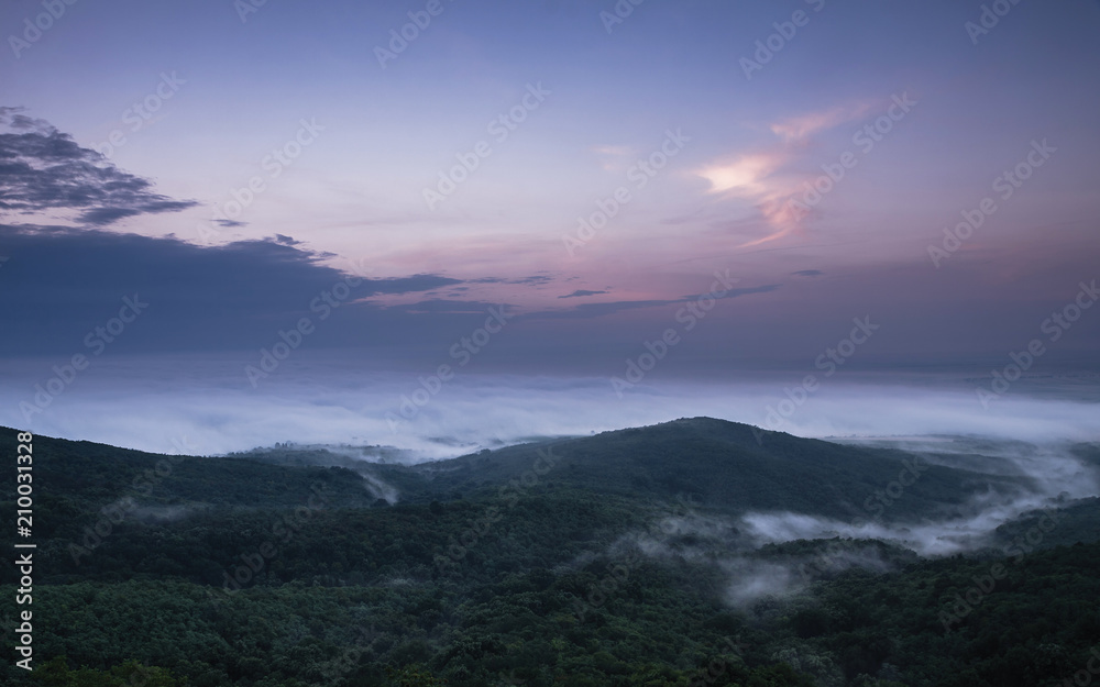 Hill surrounded with fog