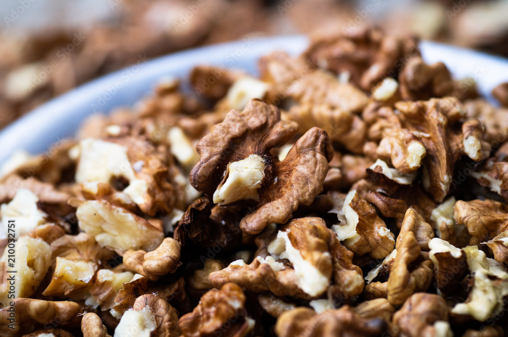 Walnuts kernels with color background, Whole walnut in a metal plate. Walnuts. Walnuts an market. Background of walnuts. Healthy. Fresh Walnuts kernels with color background, Whole walnut in a metal plate. Walnuts. Walnuts an market. Background of walnuts. Healthy. Fresh