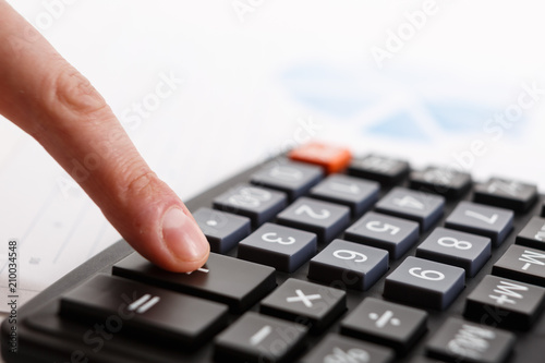 Business people use their fingers to compute calculations