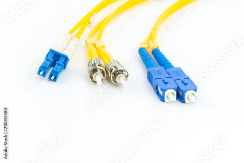 Single mode fiber optic cables patch cord with LC, SC and ST connector type on white background photo