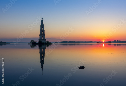 Flooded bell tower of St. Nicholas Cathedral in Kalyazin Kalyazin at sunrise, Tver region, Russia