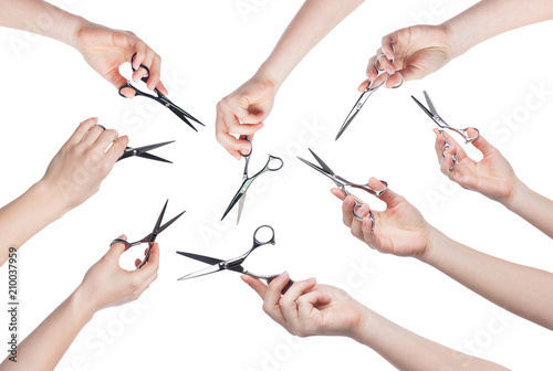 Canvas Print Hairdresser holding scissors in hand isolated on white background