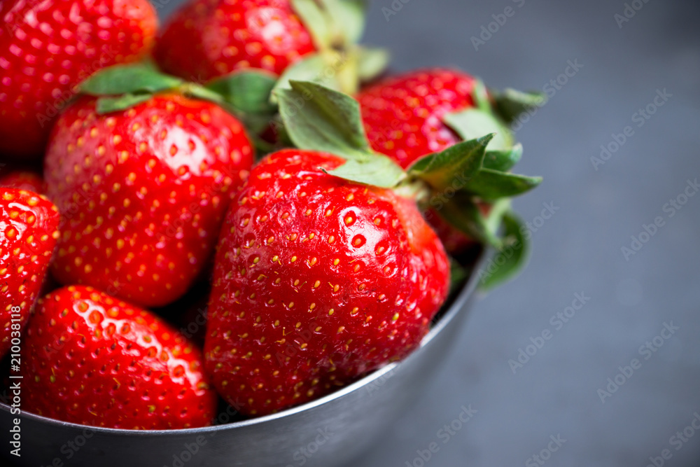 Ripe strawberries on the rustic background. Selective focus. Ripe strawberries on the rustic background. Selective focus.