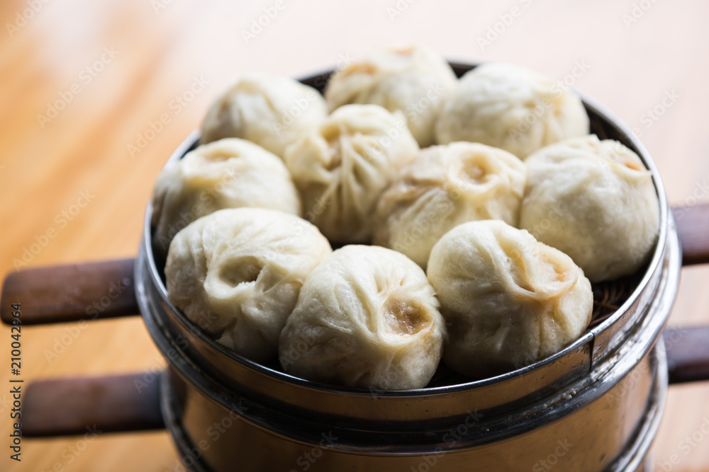 Xiaolongbao, dim sum in bamboo steamer. Dumplings in bamboo steamer