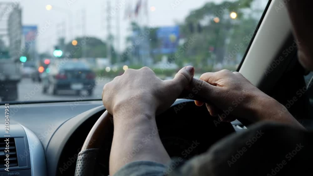 adult man hand chauffeur control steering wheel of car driving on road adult man hand chauffeur control steering wheel of car driving on road