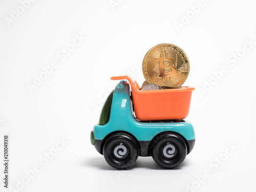 Toy car truck and bitcoin isolated on white background