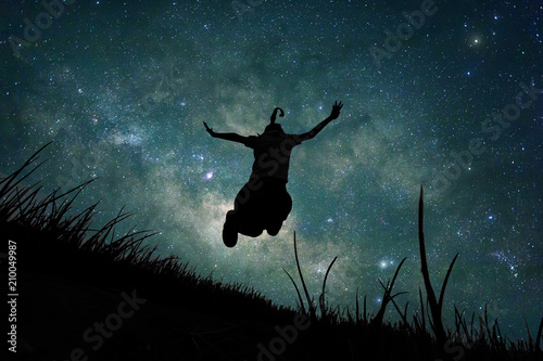 Tableau sur Toile Young girl jumping into space, silhouette image