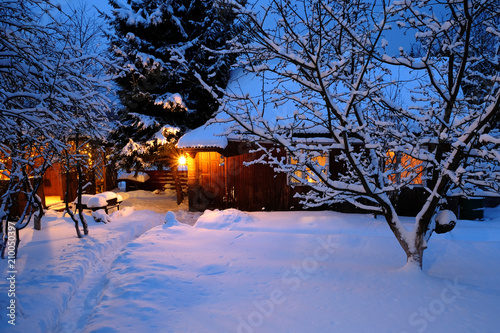 wooden house in winter forest