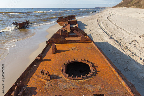 Remains of a ship thrown ashore. Baltic seacoast