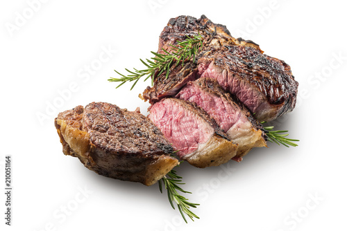Sliced T-bone steak with rosemary