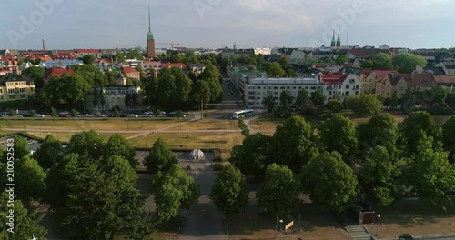 Summer city, C4k aerial rising view of Eira and Merisatama, on a sunny summer morning dawn, in Helsinki, Uusimaa, Finland photo