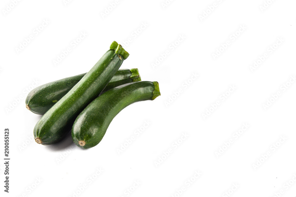 Three courgettes on a white background Three courgettes on a white background