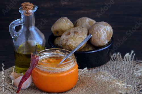 Local Canary Islands dish, Papas Arrugadas (wrinkly potatoes) with Mojo picon (red sauce). photo