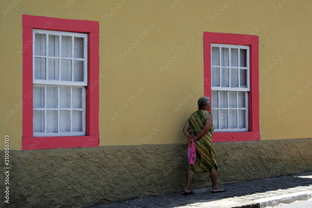 Old lady walks on the streets of Santana de Parnaíba São Paulo Brazil