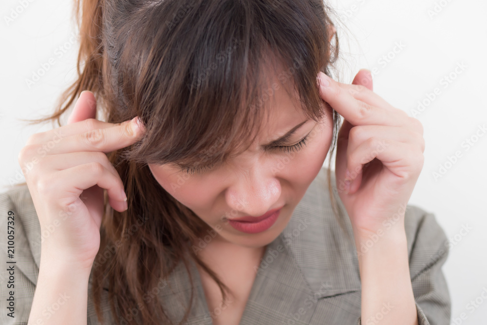 portrait of stressed sick woman with headache; ill woman suffers from vertigo, dizziness, migraine, hangover, health care concept; young adult asian woman model portrait of stressed sick woman with headache; ill woman suffers from vertigo, dizziness, migraine, hangover, health care concept; young adult asian woman model