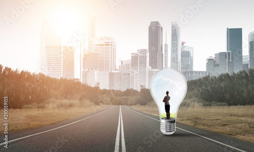 Businesswoman inside light bulb