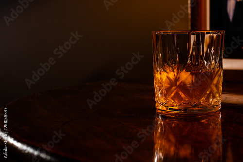 Whiskey on the rocks in a crystal tumbler