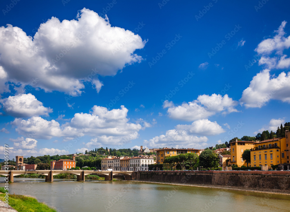 Florence cityscape with Arno River embankment and Ponte alle Grazie bridge Tuscany Italy
