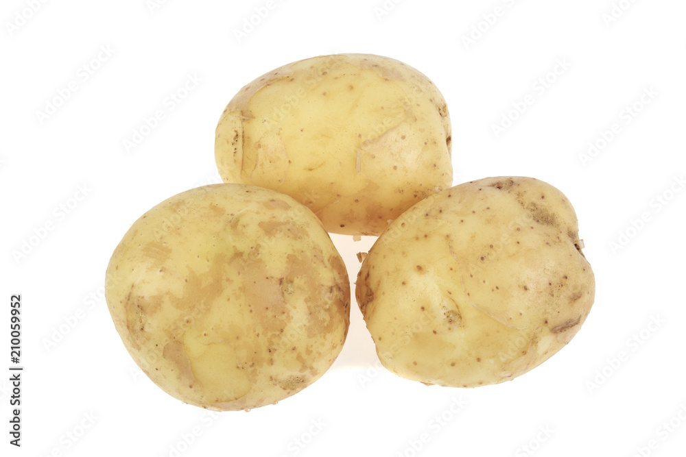 pile of young potatoes on a white background pile of young potatoes on a white background