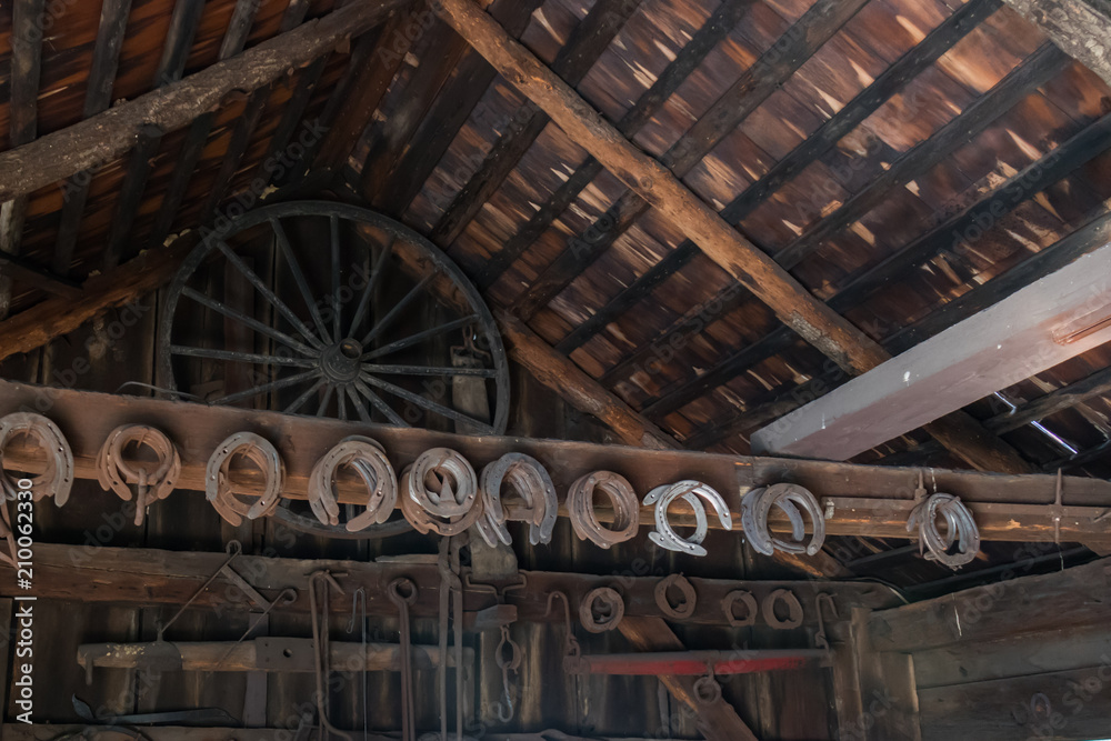 Barn loft with horseshoes and tools on rafters
