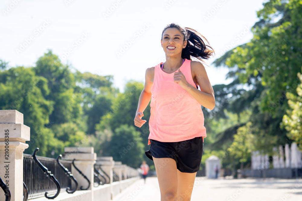 young attractive happy runner working out in a city party in fitness concept - obrazy, fototapety, plakaty 