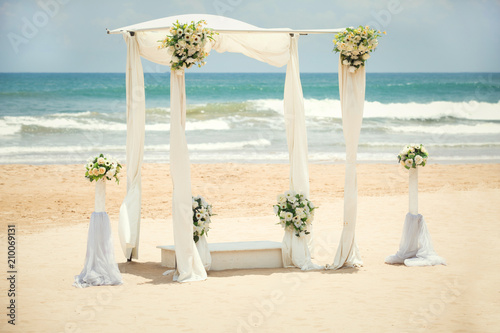 Fototapeta Naklejka Na Ścianę i Meble -  Wedding decorations on the beach of the Indian Ocean, Bentota, Sri Lanka