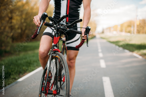 Fototapeta Naklejka Na Ścianę i Meble -  Cyclist in helmet and sportswear, bicycle training