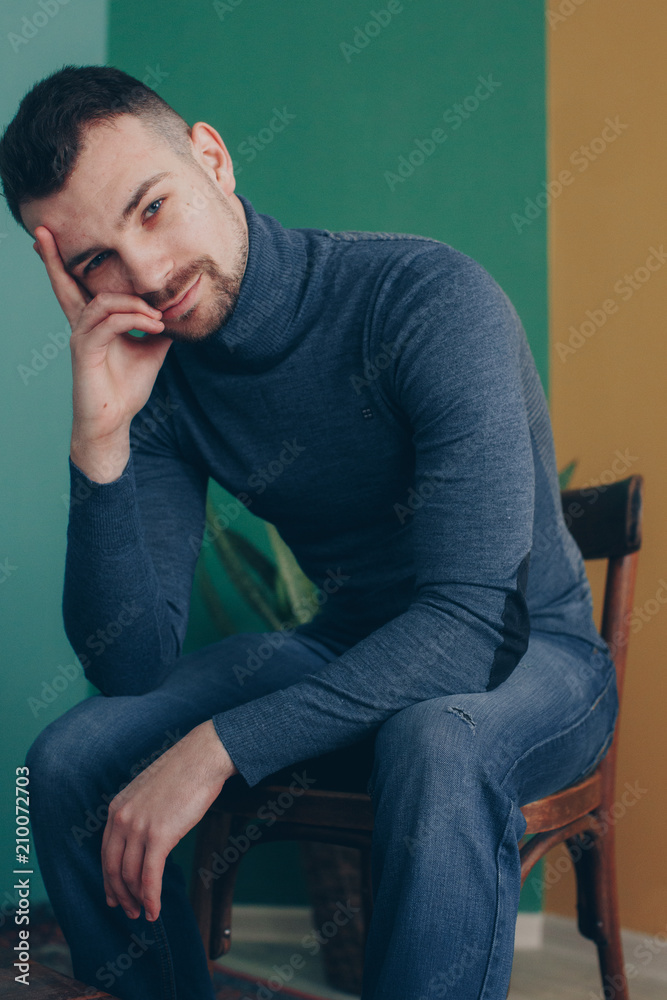 handsome young guy being photographed in studio handsome young guy being photographed in studio