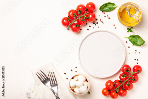 Tomatoes, basil, mozzarella cheese. Caprese salad ingredients