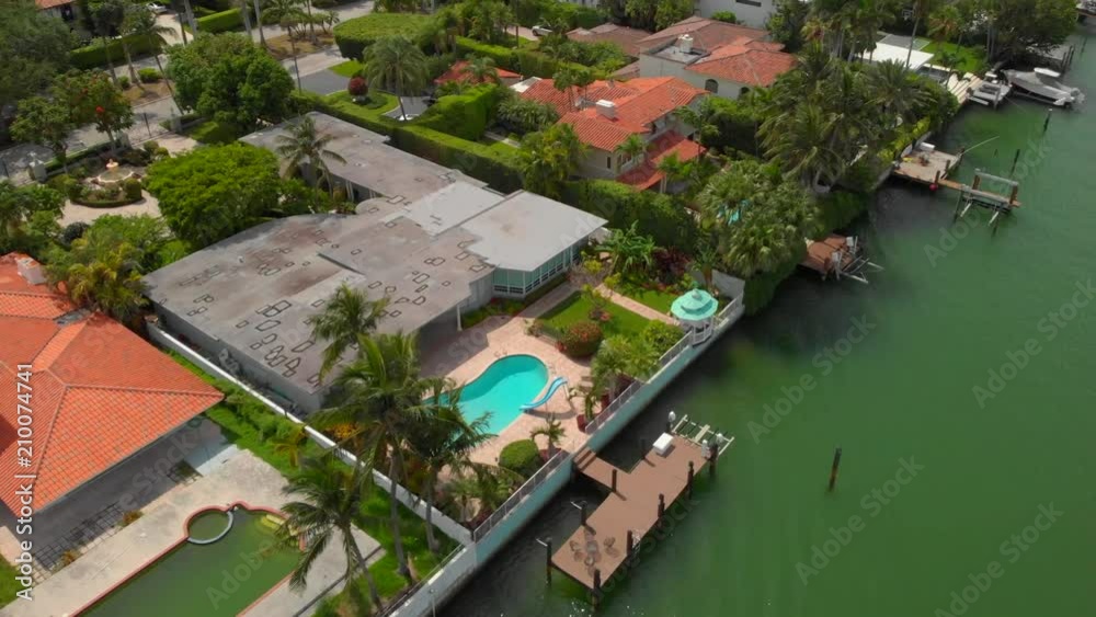 Aerial reveal waterfront mansions Miami Beach Indian Creek