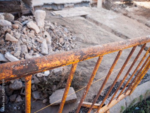 Old, yellow fence at construction aite photo