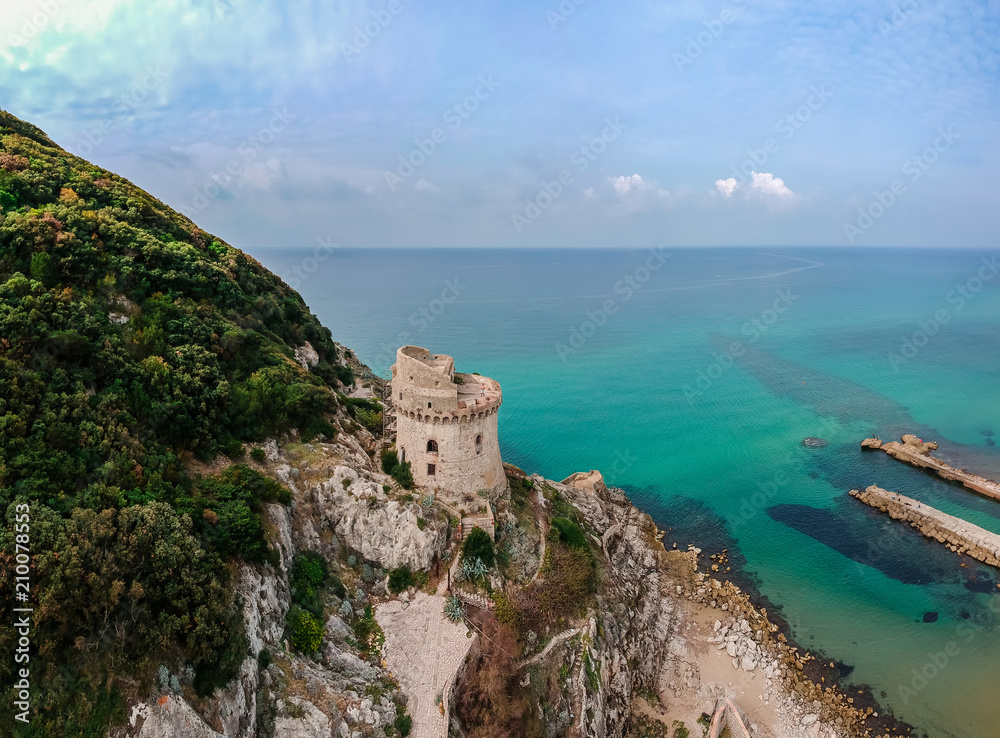 Panoramic landscape with ancient tower in Sabaudia, Lazio, Italy. Scenic resort town village with nice sand beach and clear blue water. Famous tourist destination in Riviera de Ulisse