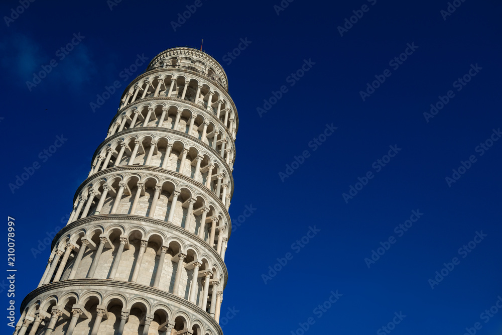 Leaning Tower of Pisa seen from below against a blue sky (with copy sapce)
