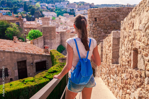 Photography Tourist woman in Badia bay in Tossa de Mar in Girona, Catalonia, Spain near of Barcelona